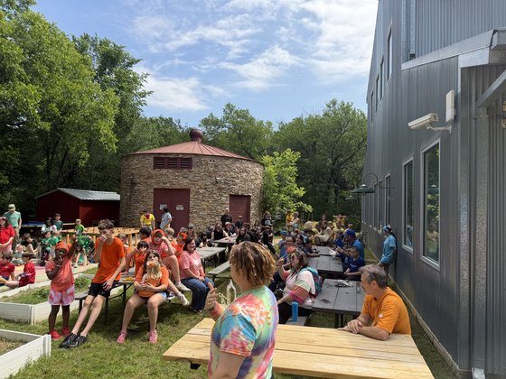 Students and families gathered at picnic tables on the Selwyn campus