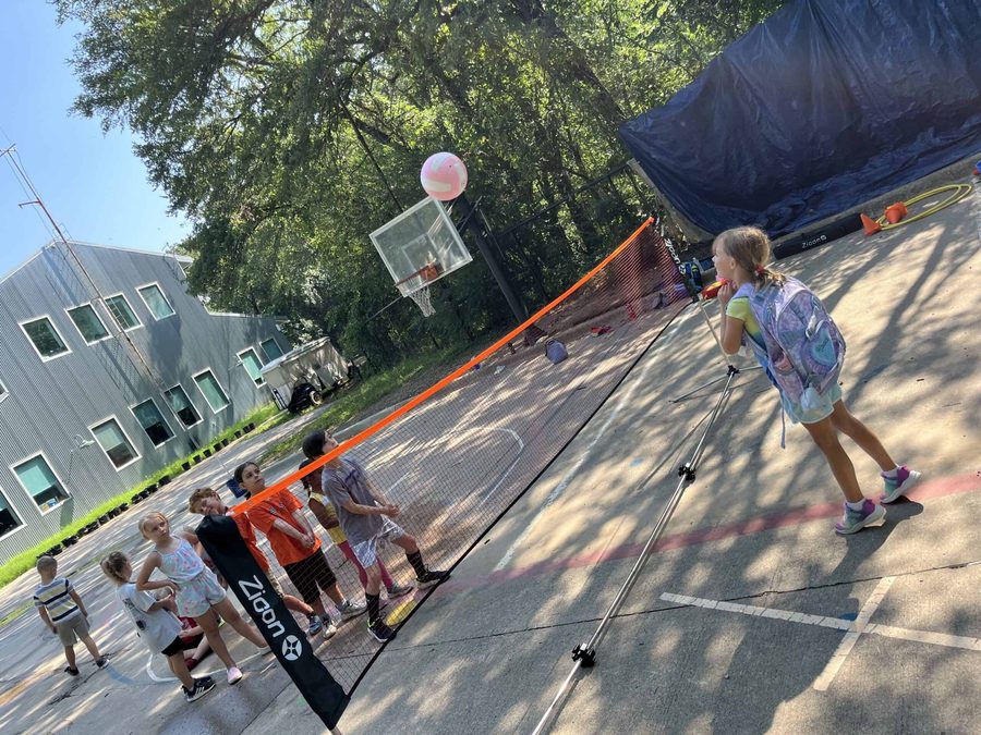 Selwyn students playing volleyball on the outdoor court